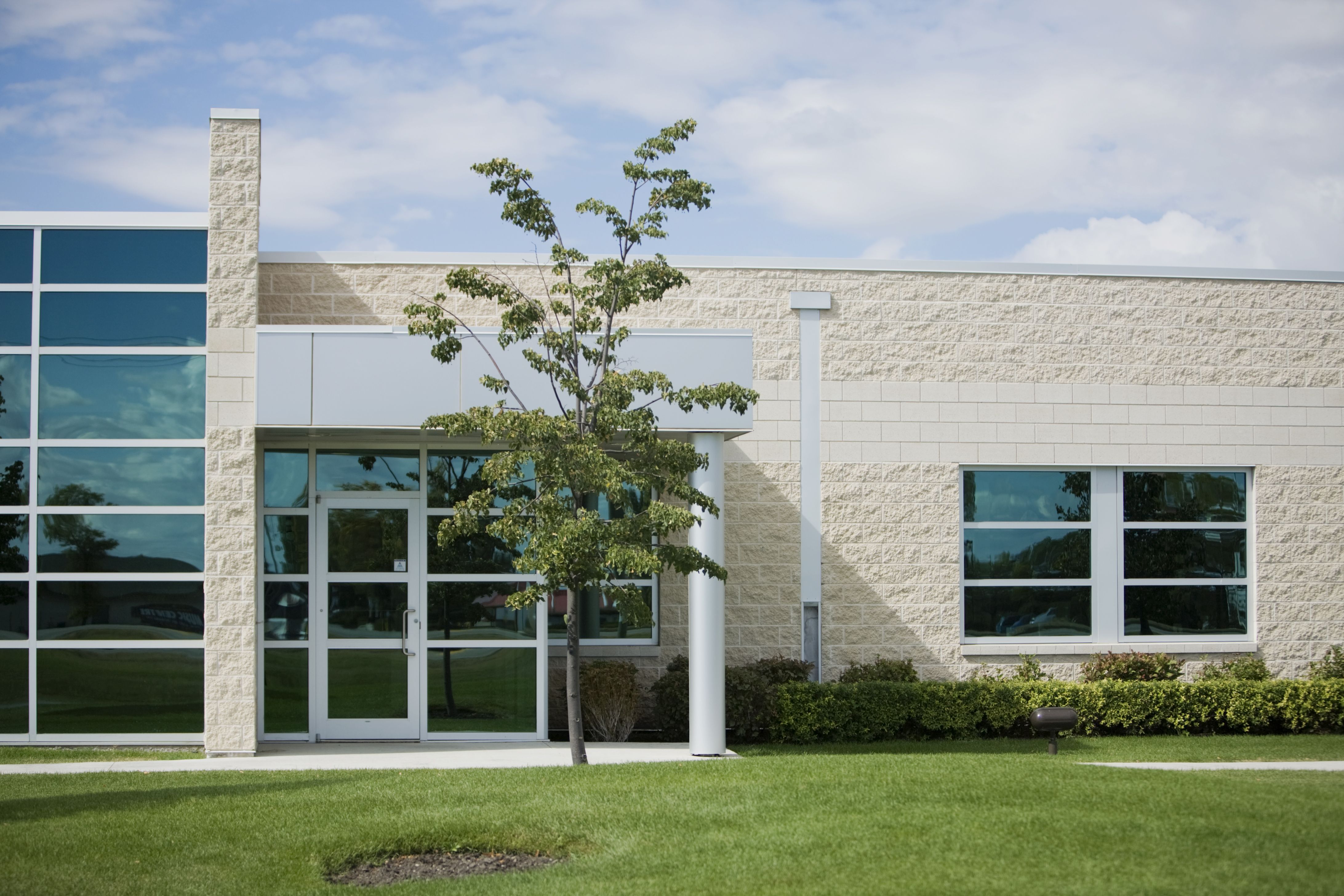 Commercial property with trees and lawn